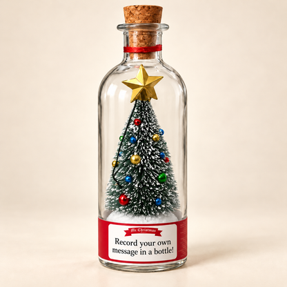 Christmas Message in a Bottle with snow-dusted tree and gold star on an ivory background